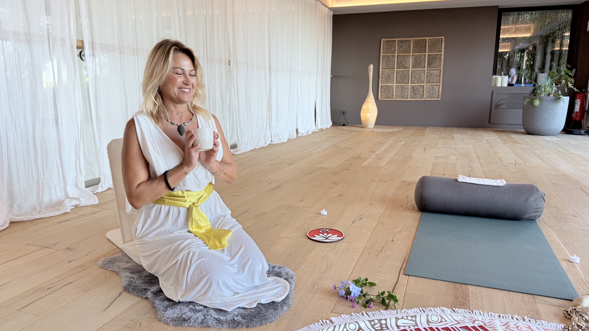 Jeanie guiding a practice in a retreat space